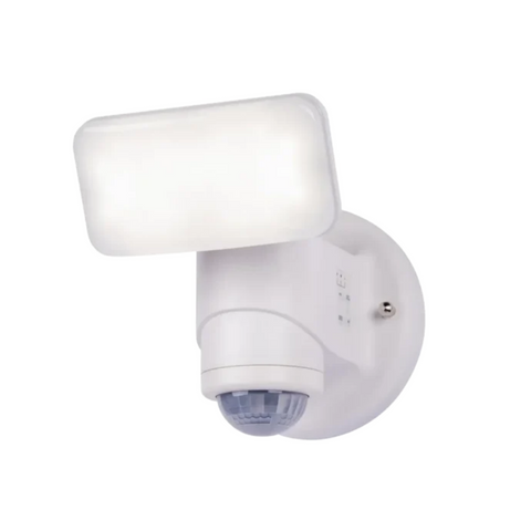 White motion security light with a rectangular lamp head, sensor beneath it and round mounting base.
