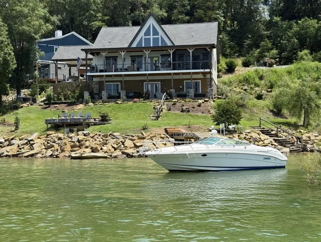 White speedboat with blue trim on Douglas Lake, East Tennessee
