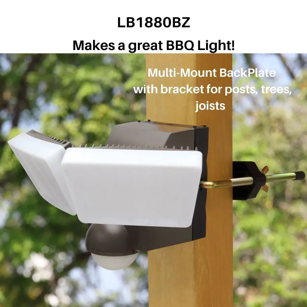 White and black multi-mount outdoor LED motion security light with battery power and sensor for posts or trees
