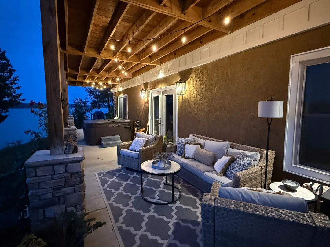 Woven wicker sectional sofa with light gray cushions in Douglas Lake luxury home