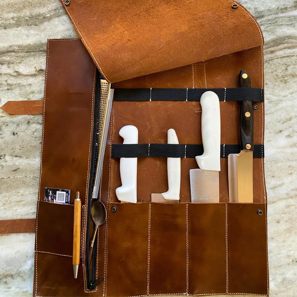 Brown premium leather knife roll with 5 pockets holding kitchen knives and utensils for secure storage
