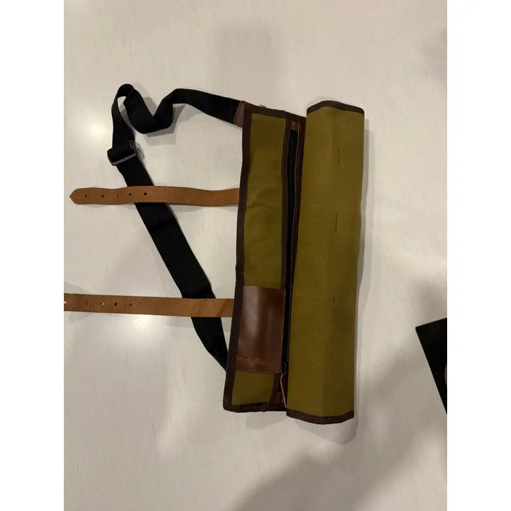 Olive green blade guard waxed canvas knife roll bag with brown leather trim black straps and dedicated knife pockets