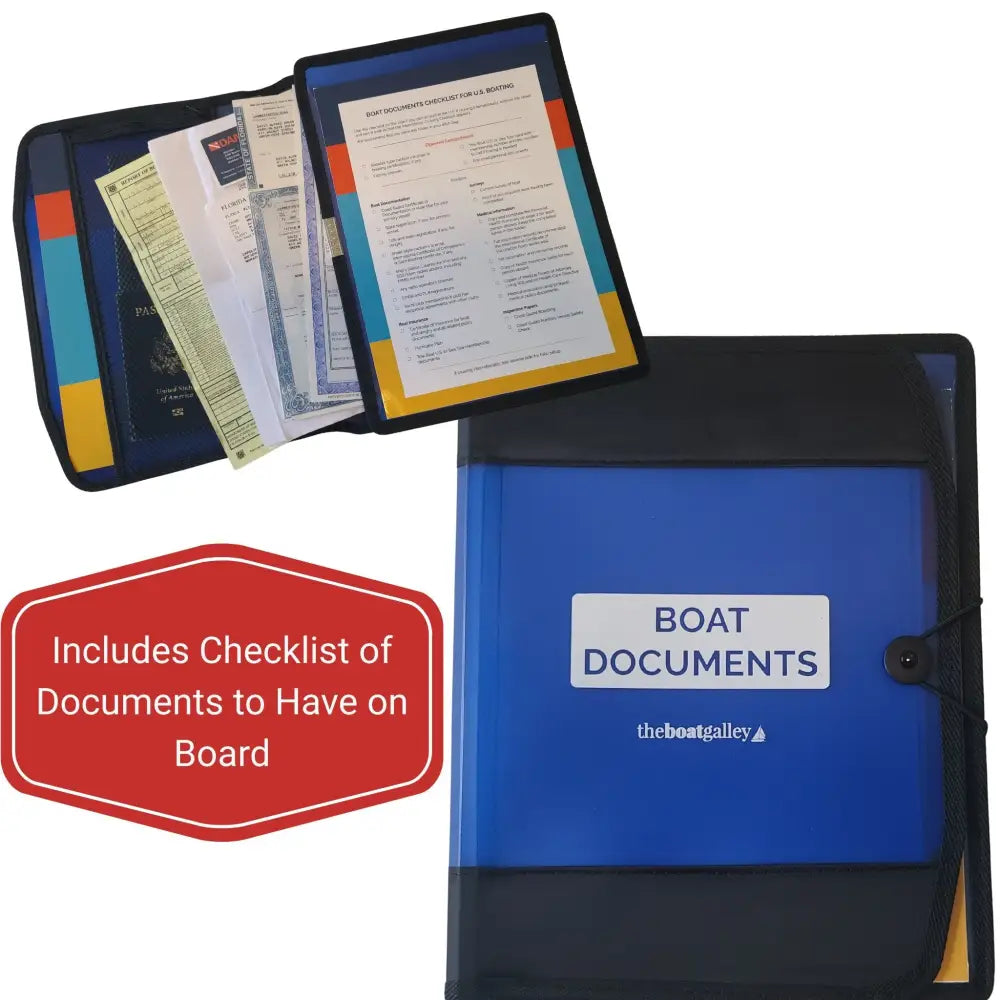 Blue and black boat documents organizer with clear front panel elastic closure and compartments holding various boat documents