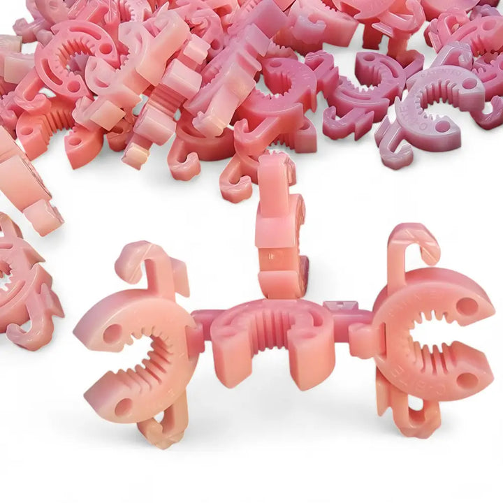 Pink plastic c-shaped c-bite flexible plant support clips with ridged grip for 7/16 inch garden stakes