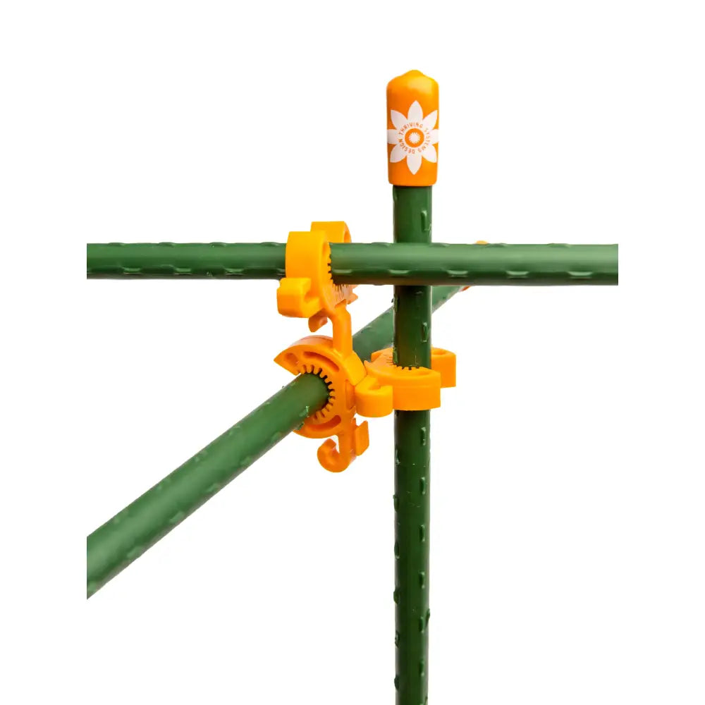 Orange plastic c-bite plant support clip with white flower design for 7/16 inch garden stakes and plant support