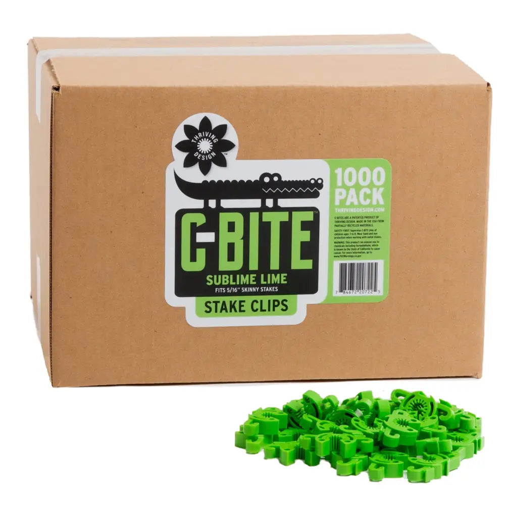 Green plastic c-bite skinny plant clips in a 1000-pack box ideal for garden stake clip use on gardening fences and tomato cages