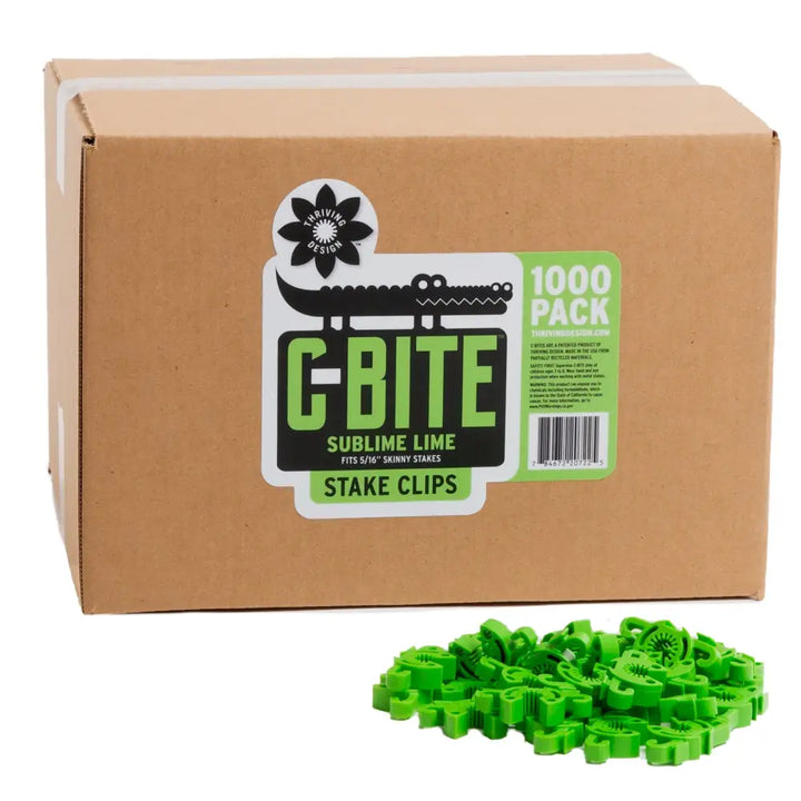 Green plastic c-bite skinny plant clips in a 1000-pack box ideal for garden stake clip use on gardening fences and tomato cages