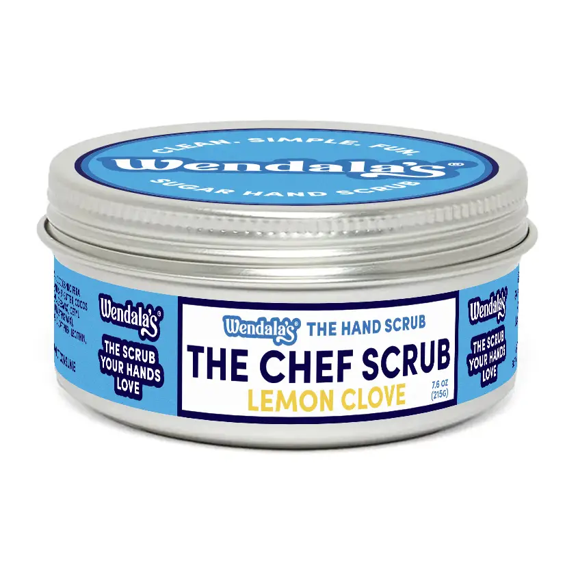 Wendalas lemon clove hand scrub in a silver tin with blue and white labeling for lemon clove hand care