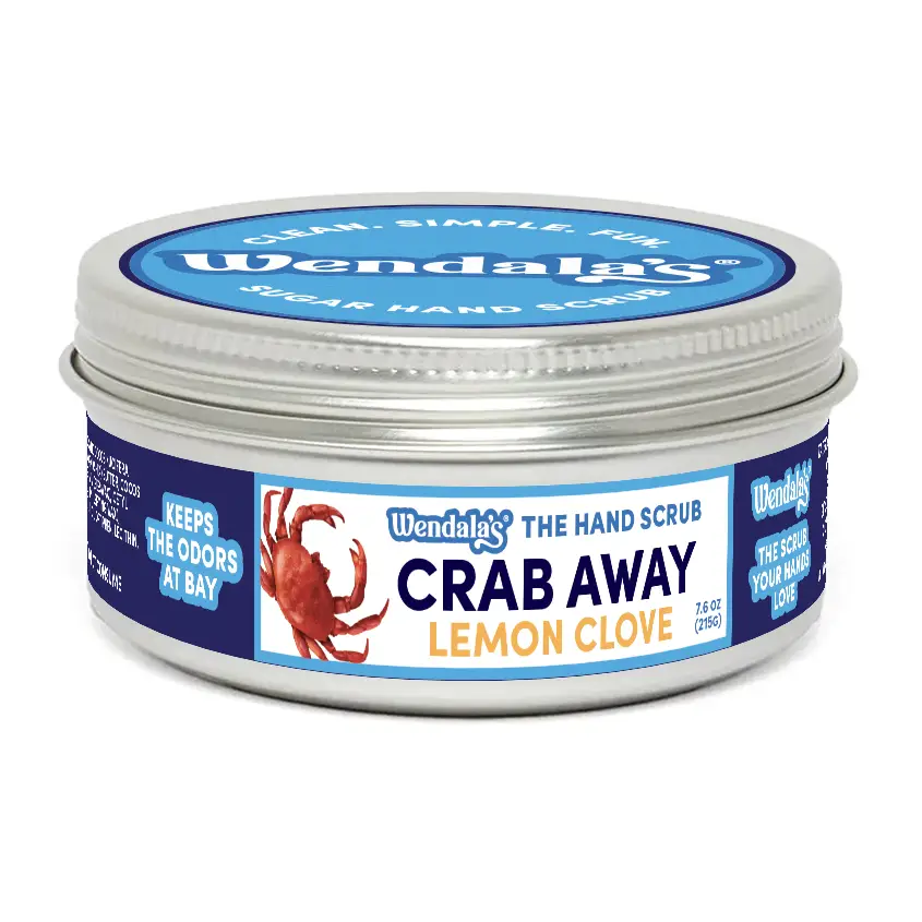 Wendala’s crab away lemon clove pure cane sugar hand scrub in a silver tin with blue and white labeling