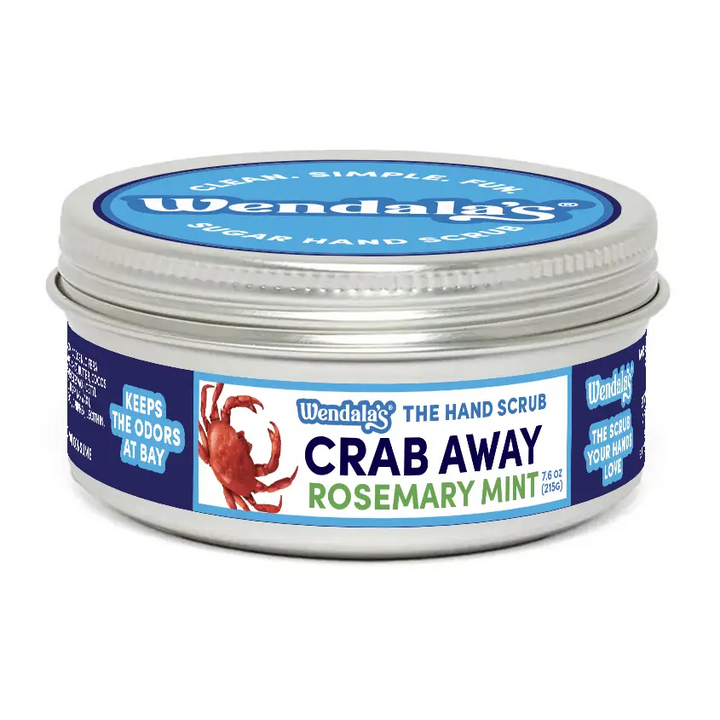Wendala’s crab away rosemary mint sugar hand scrub in a silver tin with blue and white labeling featuring organic coconut ingredients