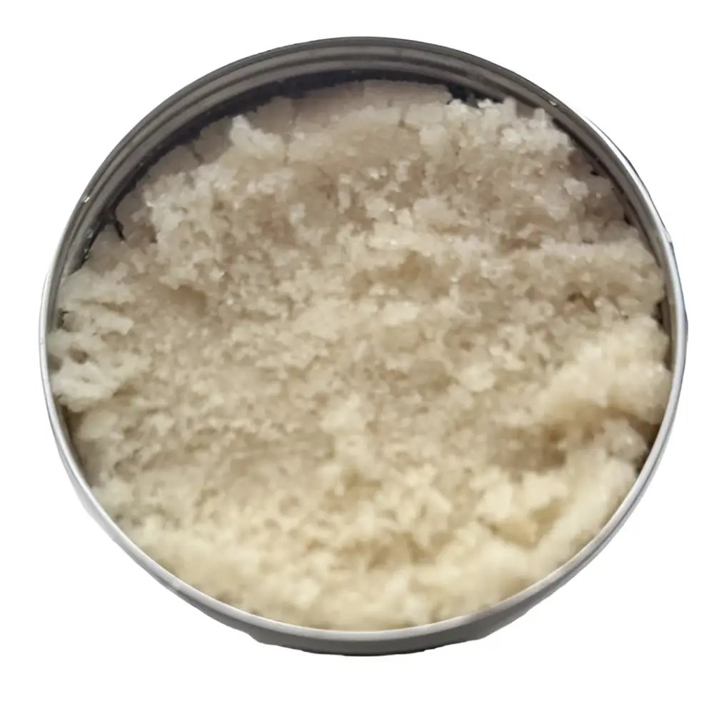 A round metallic can of wendala’s dirtx hand scrub filled with coarse off-white granular hand scrub product