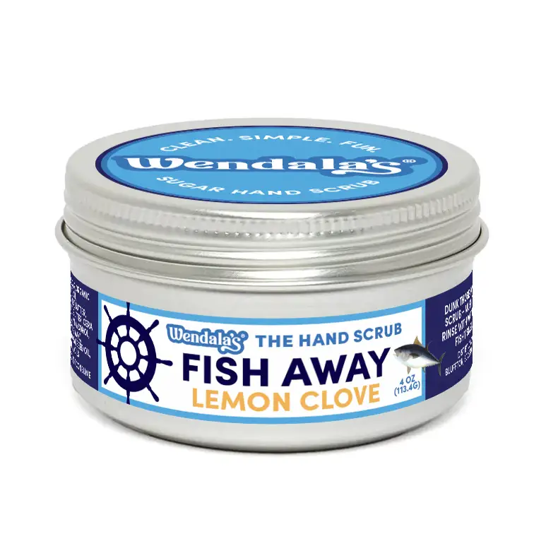 Wendalas fish away lemon clove sugar hand scrub in a silver tin with blue and white label leaves hands soft organic coconut