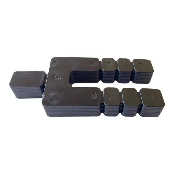 Black plastic u-shaped connector with stacked segments and circular indentations for glazelock shims stackable use