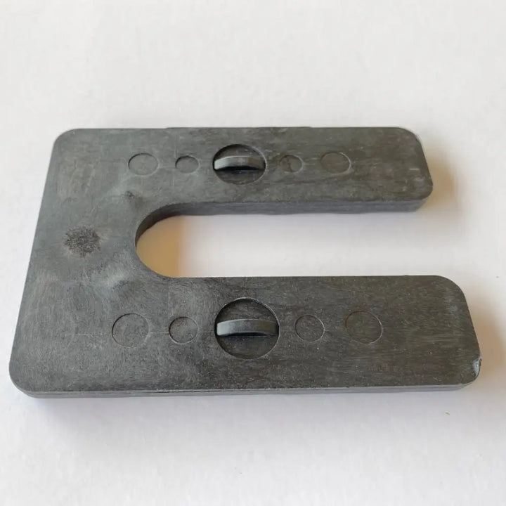 Dark gray matte plastic glazelock shims u-shaped tool with circular cutouts and edge holes for heavy-duty interlocking use