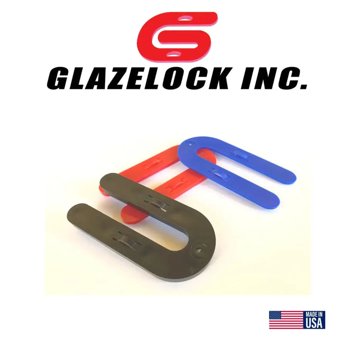 Three white u-shaped plastic glazelock shims 3 x 1-1/2 inches with 1/2 inch slot for interlocking use