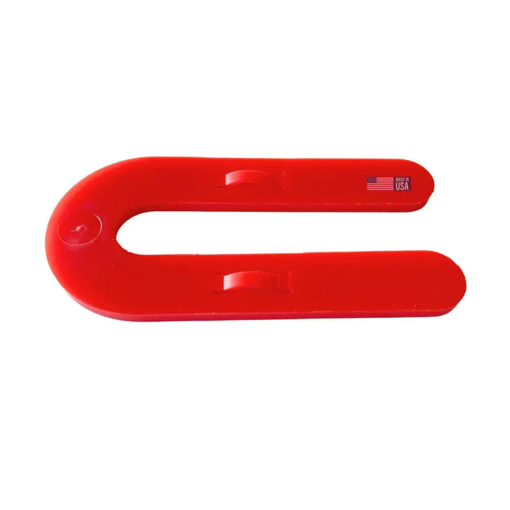 Bright red u-shaped glazelock shims with a smooth glossy finish and two small inner notches for interlocking use