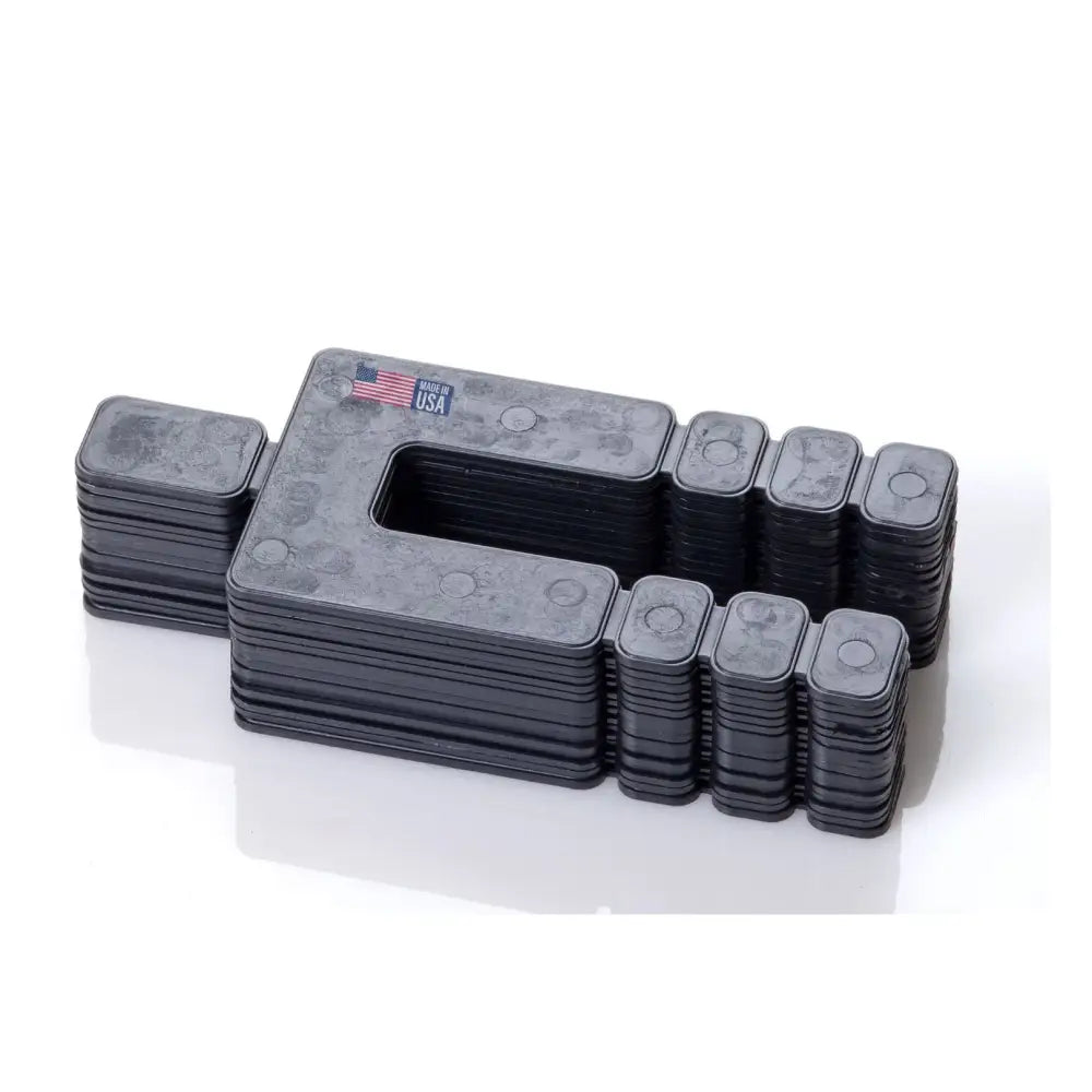 Glazelock shims black plastic modular connector blocks with matte finish and embossed circular details for wood shims