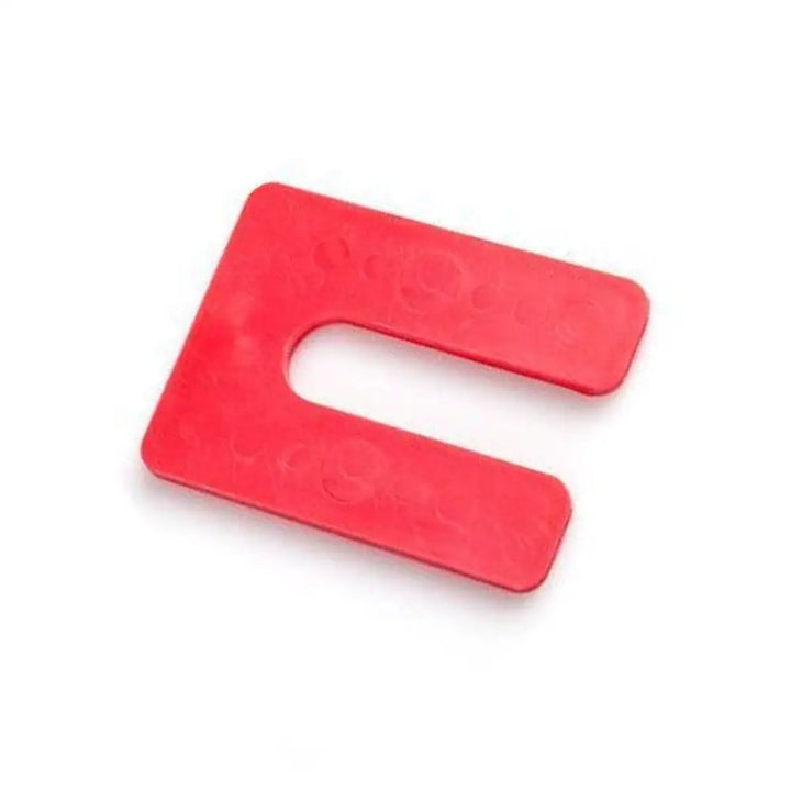 Red u-shaped glazelock shims with rounded edges and embossed circular patterns for square horseshoe slot use