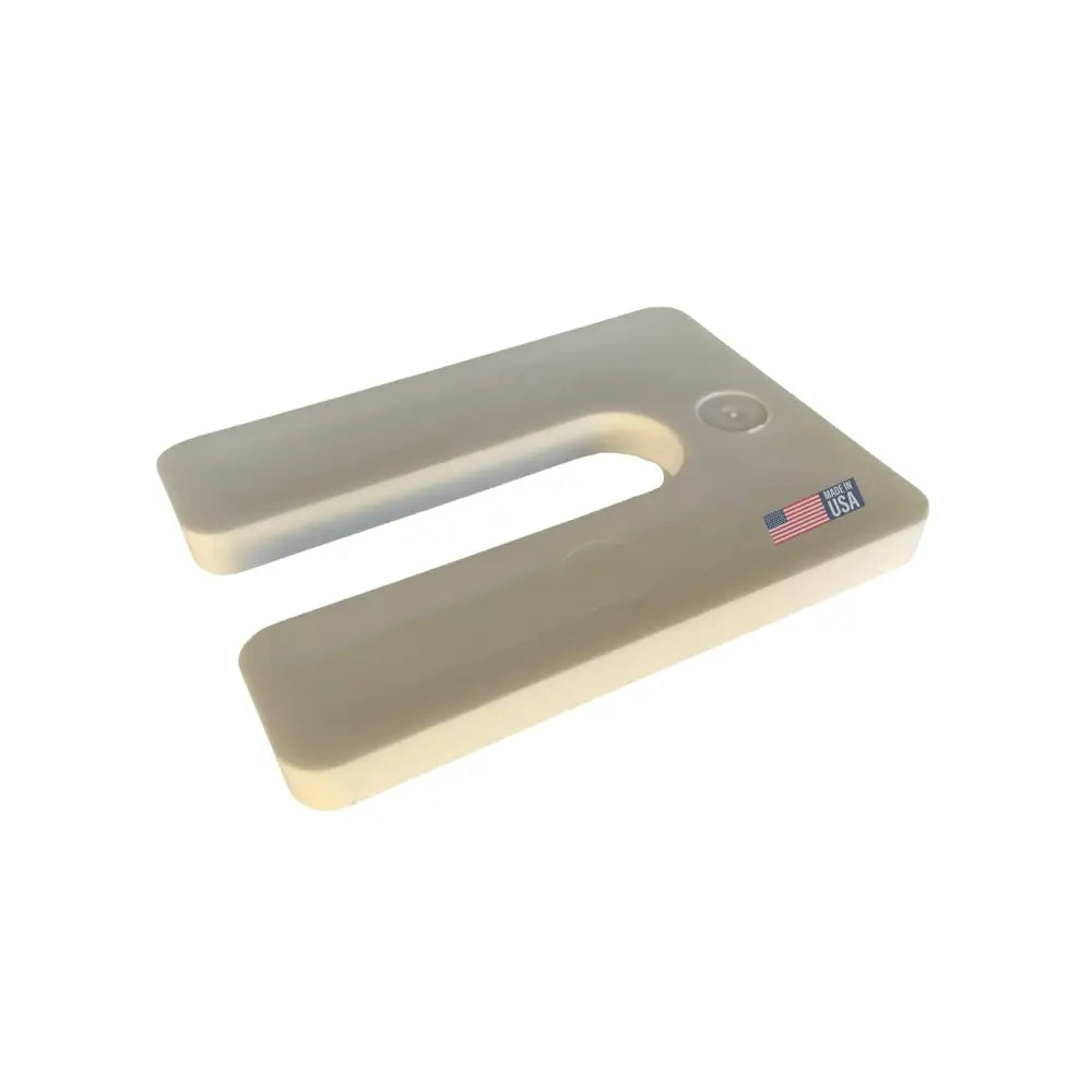 Beige plastic glazelock shims square horseshoe seat cushion with small circular indentation and american flag sticker