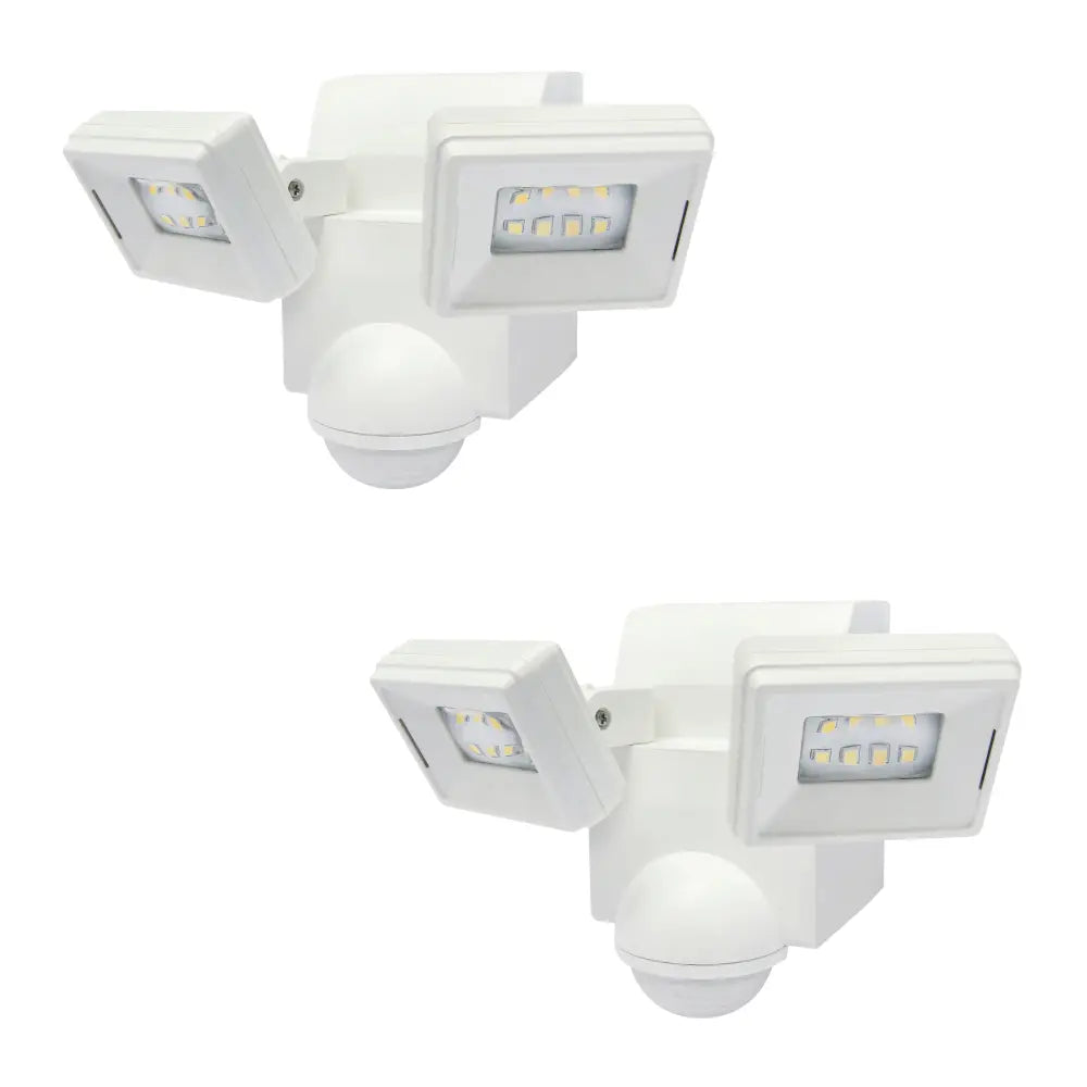 White dual-head battery powered motion sensor flood light with adjustable arms and spherical sensor base for eave mount