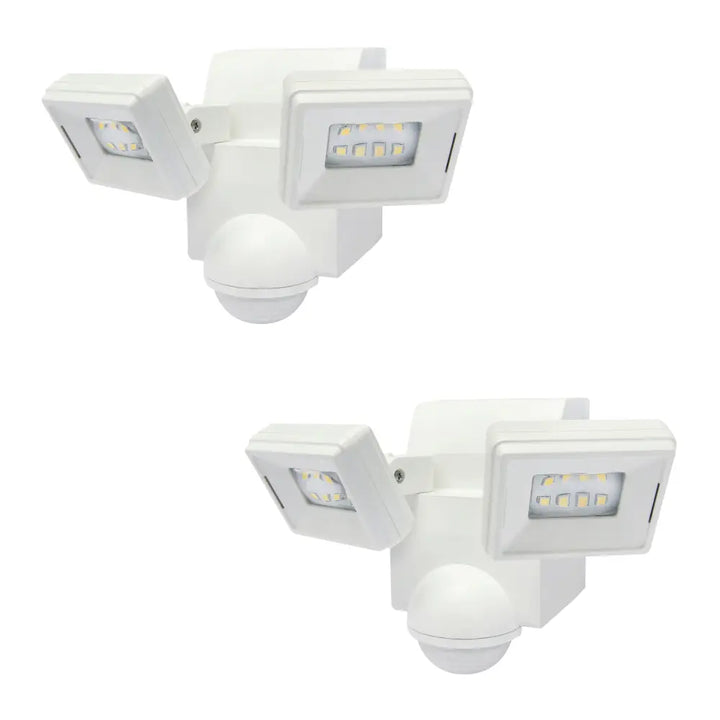 White dual-head battery powered motion sensor flood light with adjustable arms and spherical sensor base for eave mount