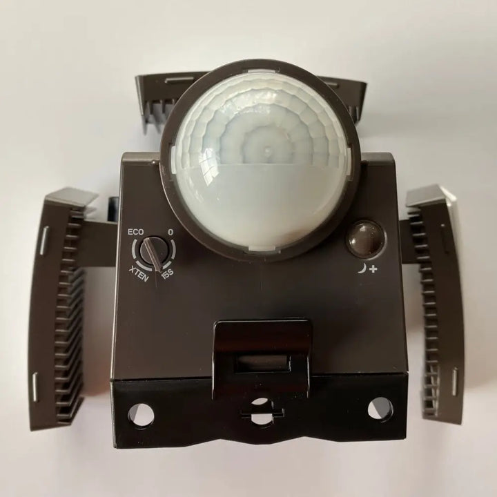 Black plastic battery powered security light with motion sensor and adjustable eco mode brightness and nightlight settings