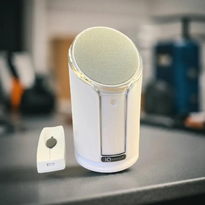 White cylindrical iq america powered wireless doorbell chime with silver mesh grille and metallic trim battery powered wireless
