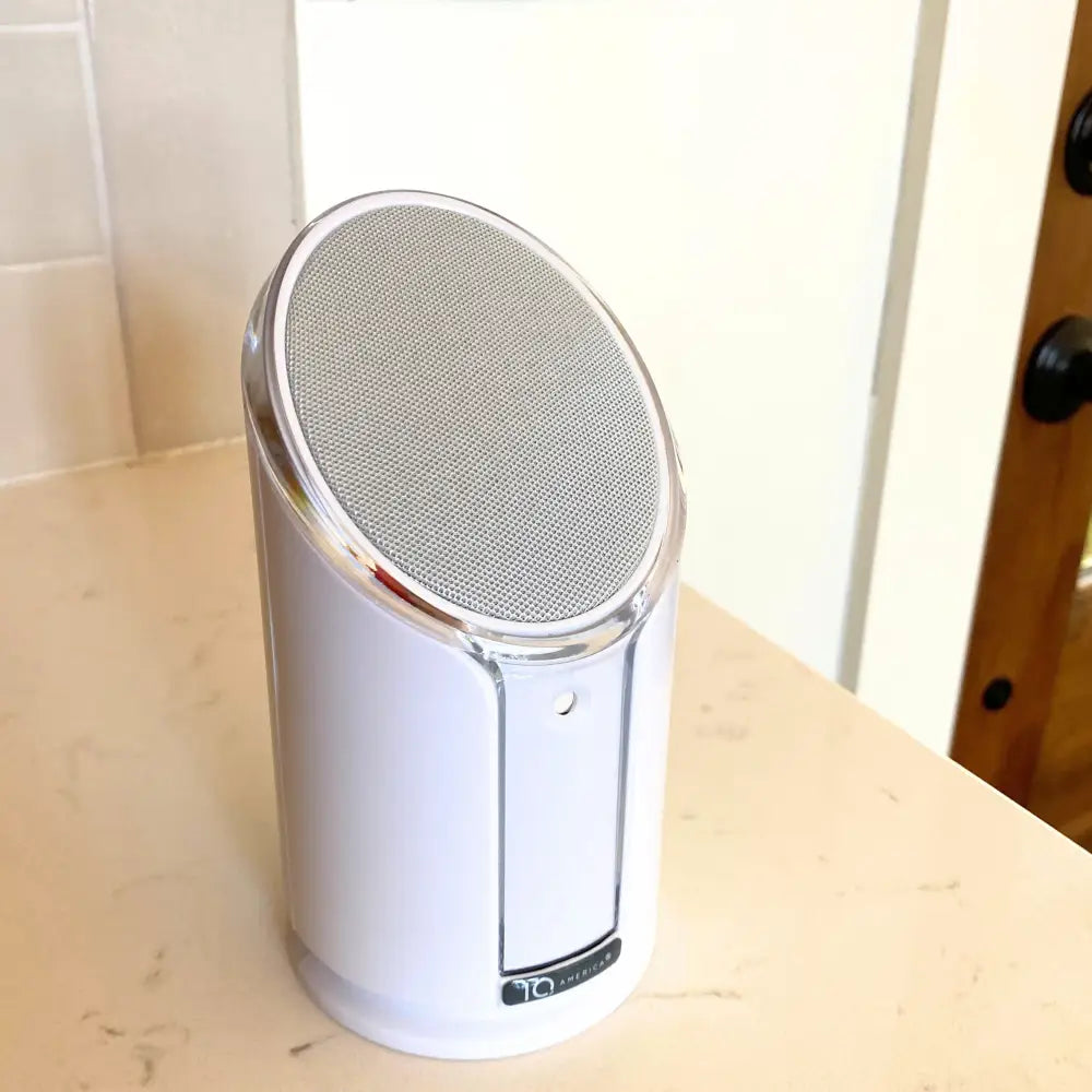 Iq america powered wireless doorbell chime featuring a white cylindrical speaker with silver mesh and chrome trim battery powered wireless