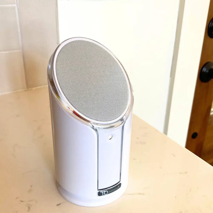 Iq america powered wireless doorbell chime featuring a white cylindrical speaker with silver mesh and chrome trim battery powered wireless