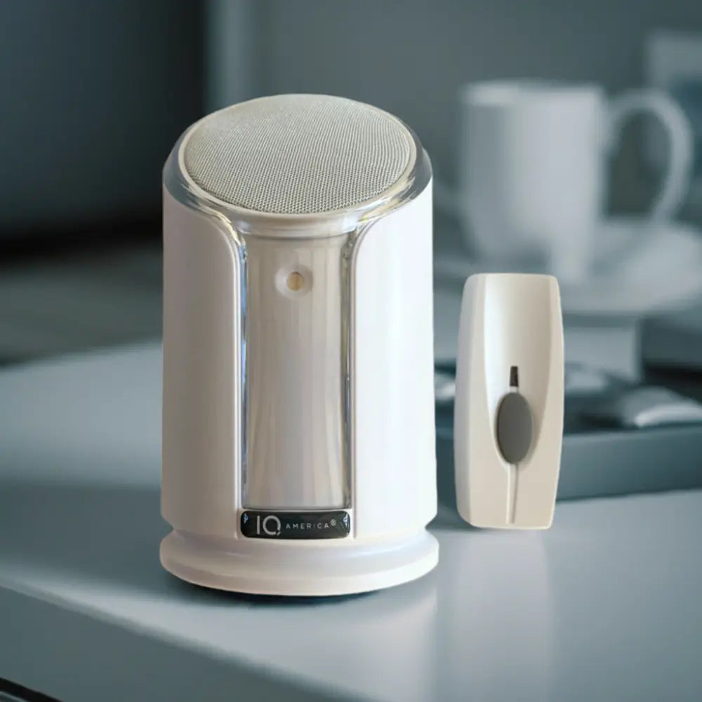 White iq america wireless portable doorbell chime kit with sleek cylindrical speaker and rectangular battery powered button