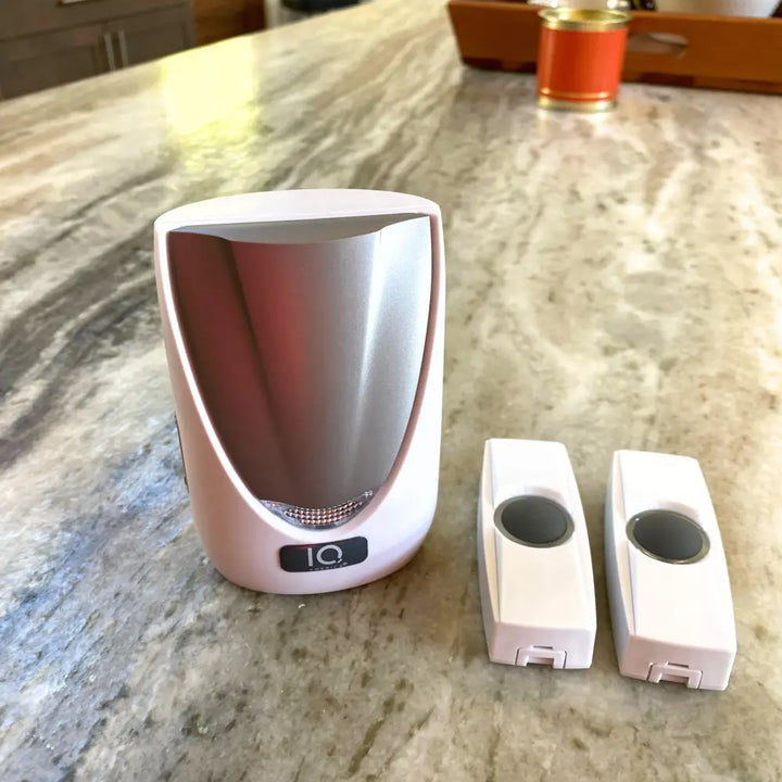 White and silver IQ America wireless portable door chime with dual battery powered wireless doorbell buttons