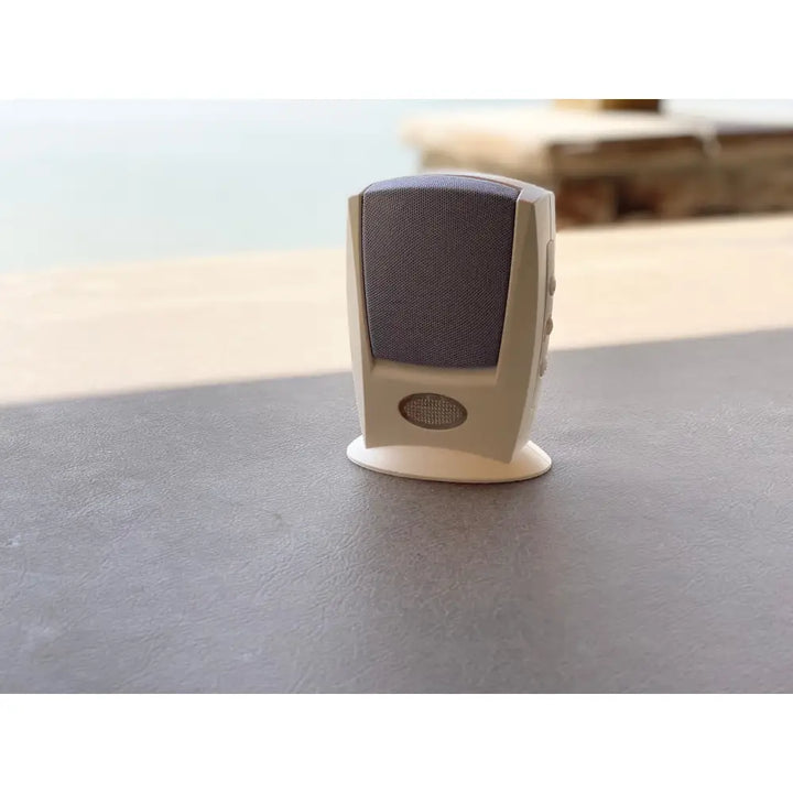 Beige iq america wireless doorbell chime with gray fabric grille and circular mesh port for entry notification products and visual alert