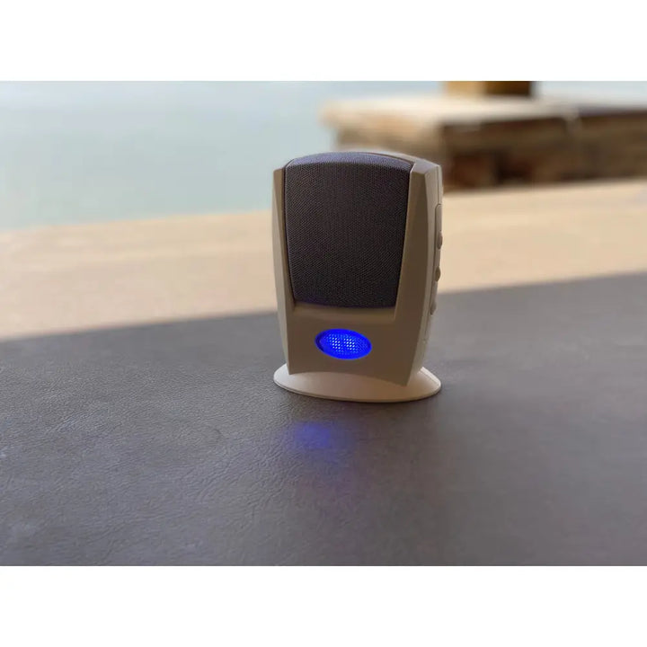 Beige desktop speaker with dark gray grille and blue led indicator for iq america wireless doorbells visual alert system