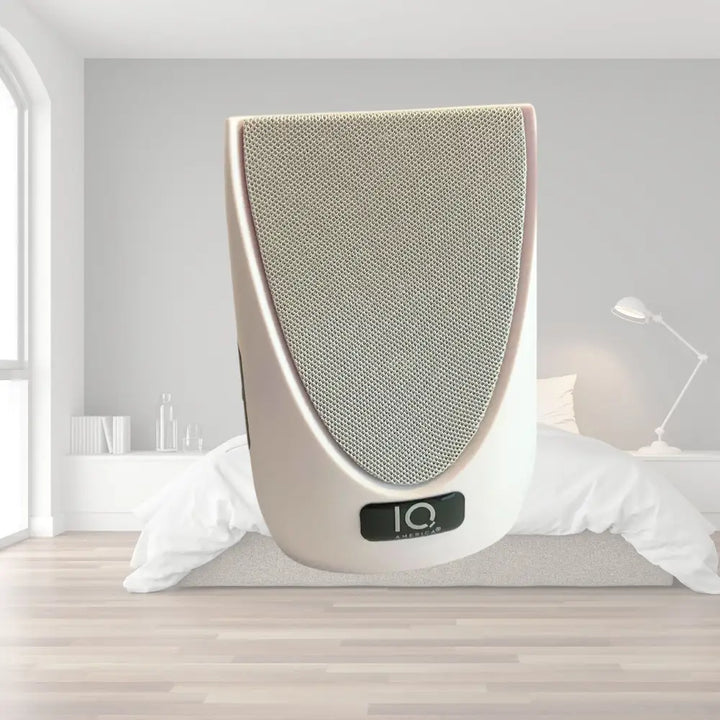 Cream-colored iq audiolab wireless portable door bell with textured gray mesh grille and sleek modern design