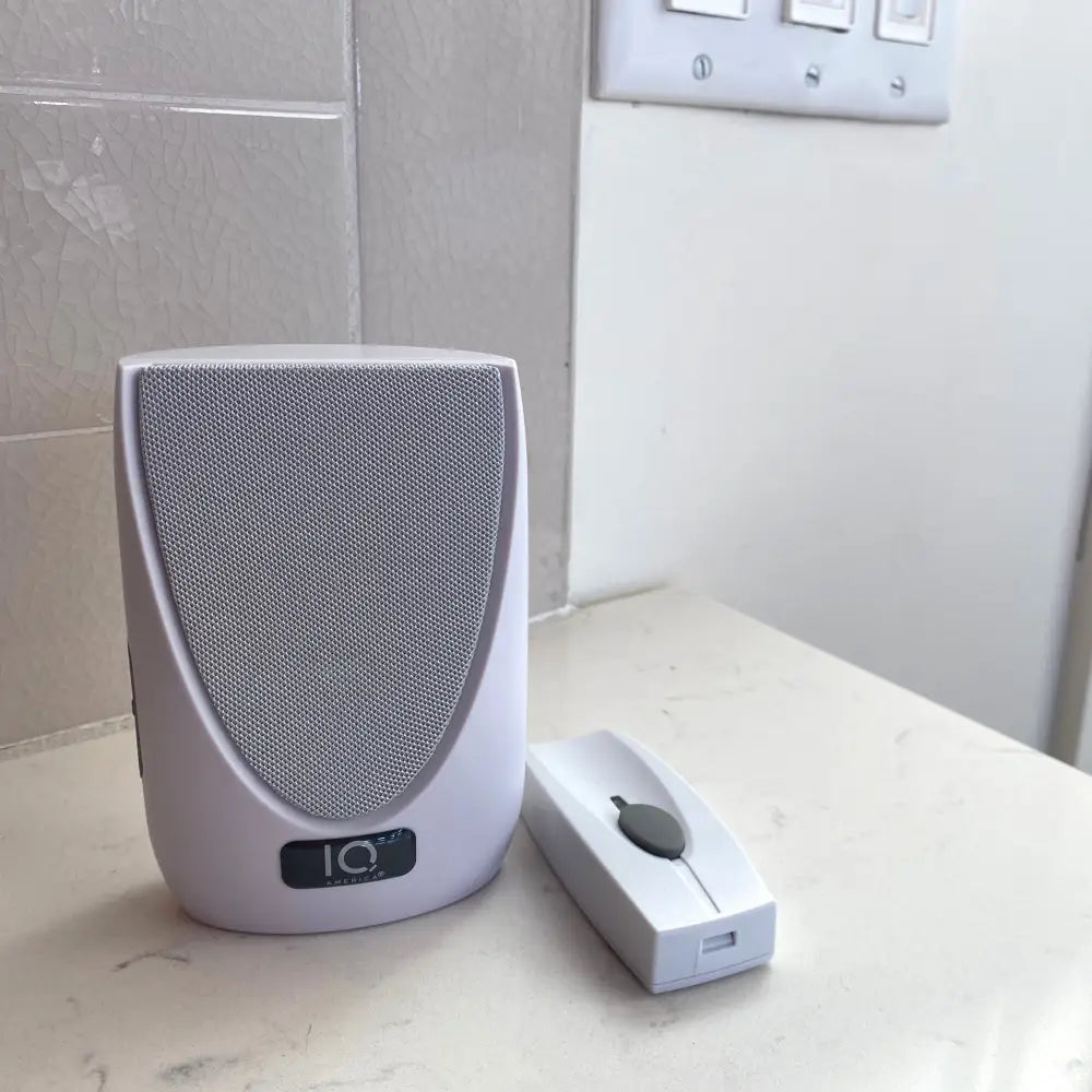 Iq america wireless portable door bell kit with white plastic wireless portable door bell and matching remote control