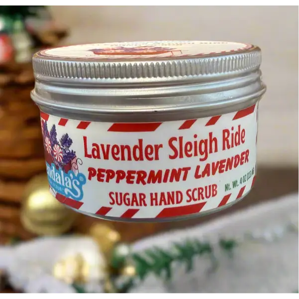 A festive silver tin of adala’s lavender sleigh ride peppermint lavender sugar hand scrub with candy cane label