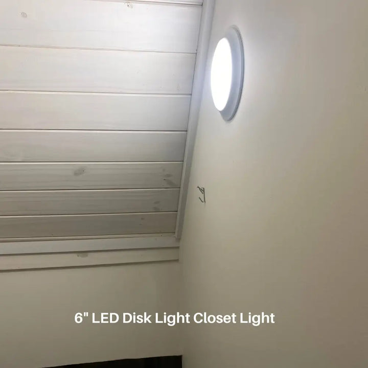 Circular white led flush mount ceiling disk light 6 inch 750 lumens mounted on wall for new installation or retrofit
