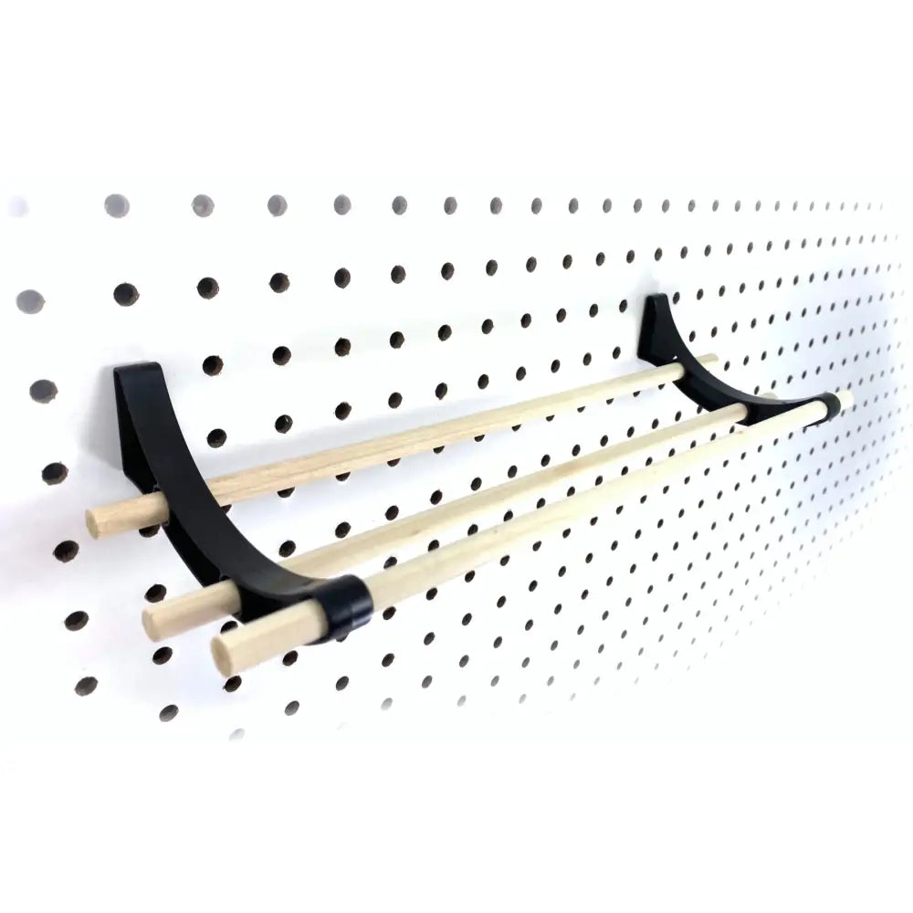 Black metal peggy pegboard organizer with three light wood dowels ideal for craft rooms ribbon organizer