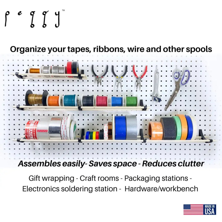 Peggy pegboard organizer wall-mounted with three shelves and dowels holding tape ribbon wire and tools for craft rooms