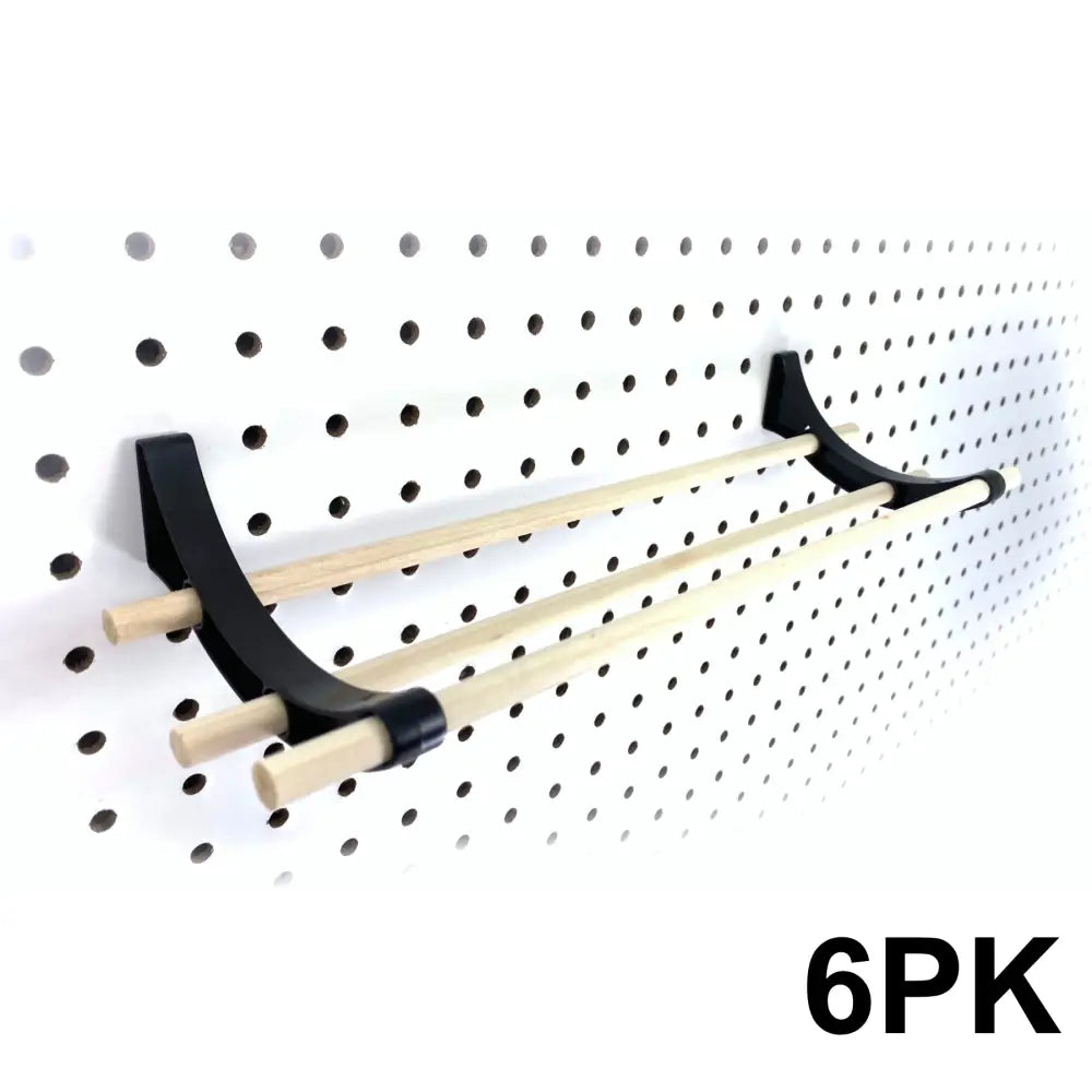 Black plastic peggy pegboard organizer with three light wooden dowels for craft rooms ribbon organizer use