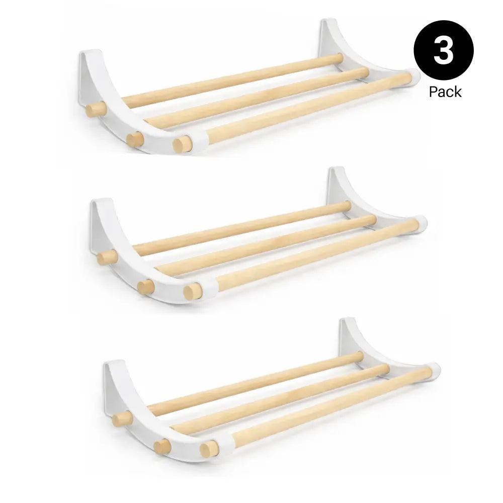 White wall-mounted towel rack for professional pegboard roll storage