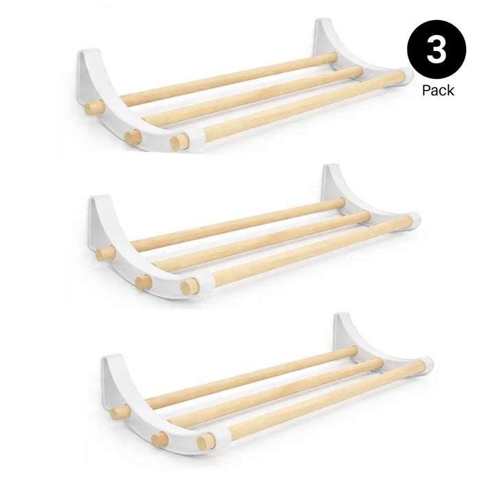 White wall-mounted towel rack for professional pegboard roll storage