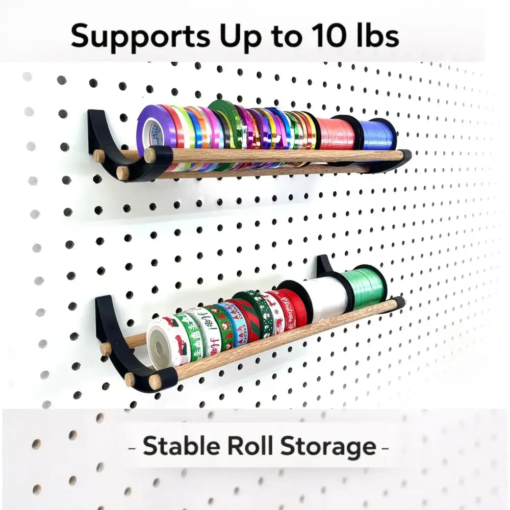 Black and wood pegboard roll storage system with heavy-duty wooden dowels and curved black metal brackets for shipping stations