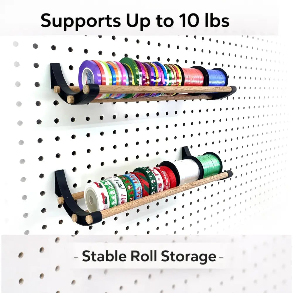 Professional pegboard roll storage with black wood shelf and colorful ribbons