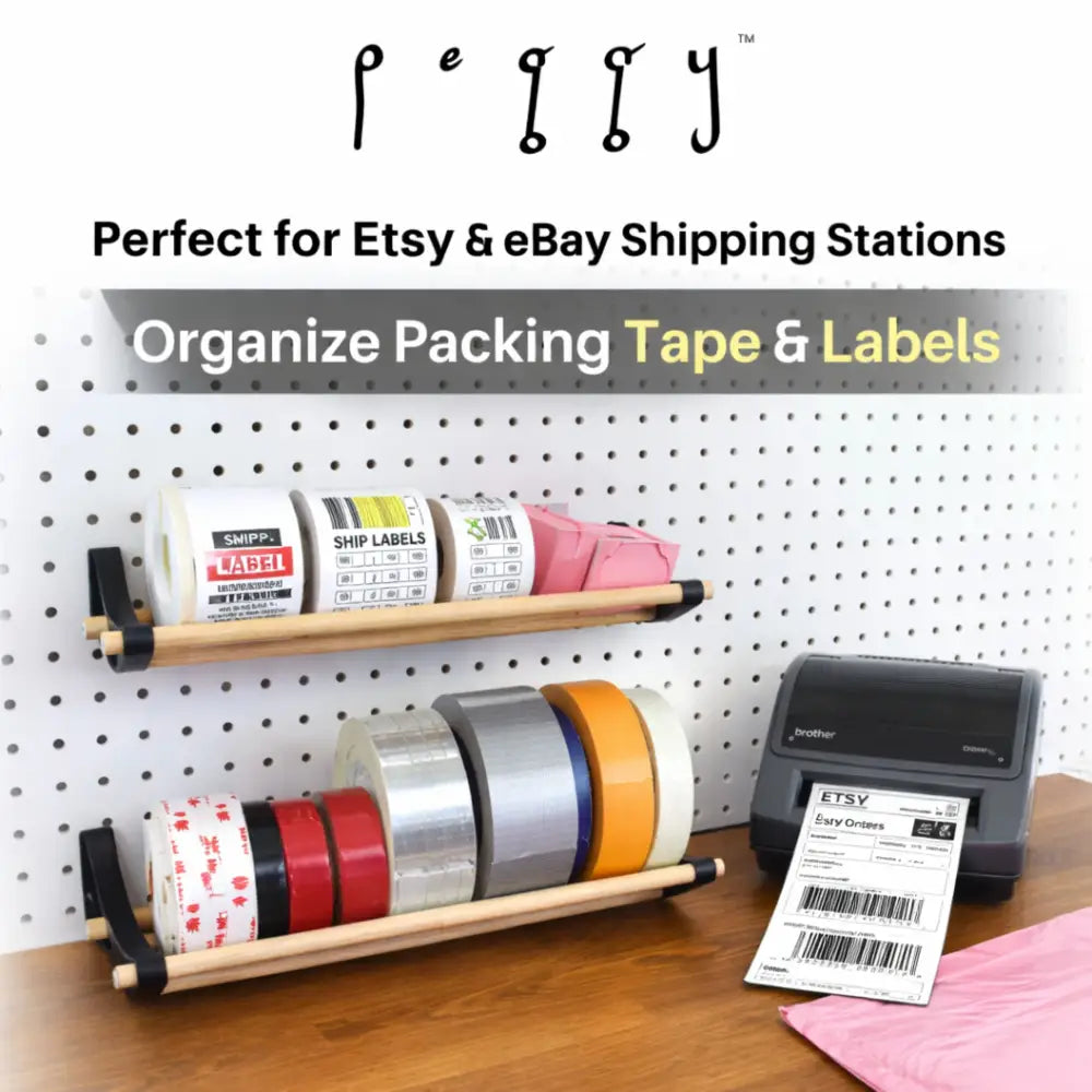 Professional pegboard roll storage with wooden shelf, black end caps, tape rolls