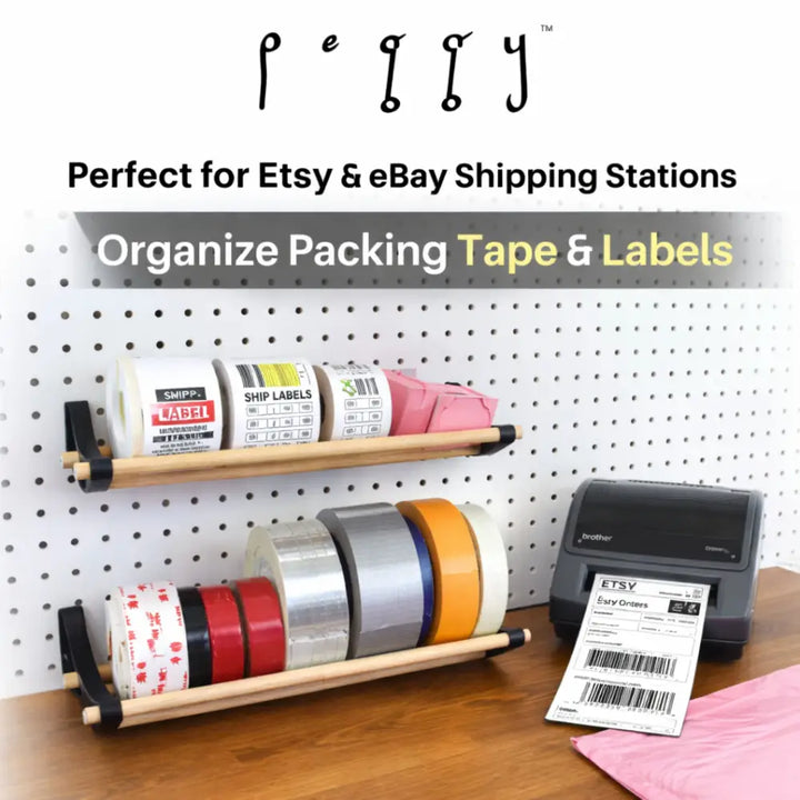 Professional pegboard roll storage with wooden shelf, black end caps, tape rolls