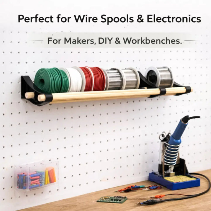 Professional pegboard roll storage with black wood shelf holding green white red silver wire spools