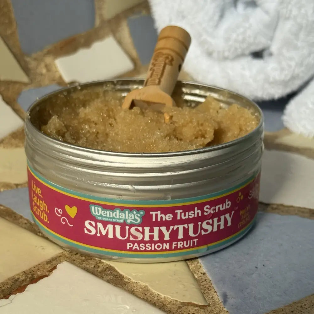 Wendalas smushytushey passion fruit sugar scrub in a silver tin with wooden spoon made with organic coconut oil