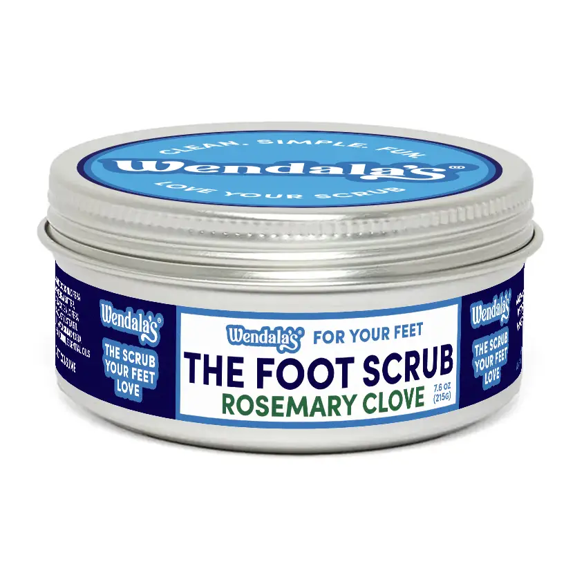 Wendala’s rosemary clove foot scrub in silver tin with blue white label featuring organic coconut butter for exfoliation