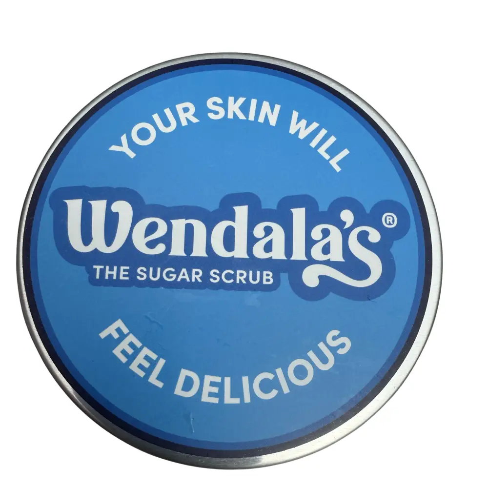 Blue circular tin of wendala’s hand scrub coconut natural with silver rim and white lettering featuring organic coconut oil